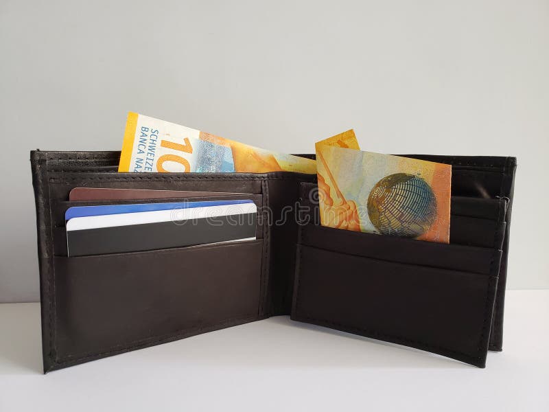 black leather wallet with  swiss banknotes and white background royalty free stock photography black leather wallet with  swiss banknotes and white background royalty free stock photography